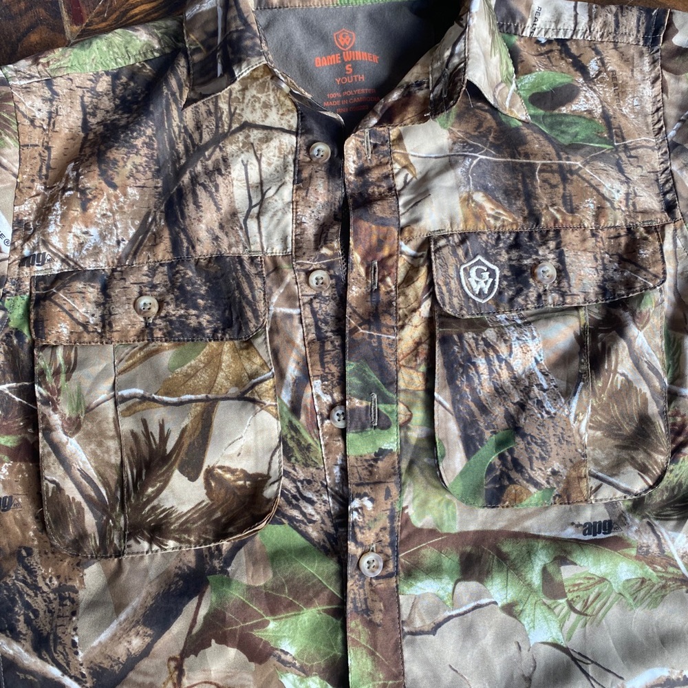 Like new youth small game winner camo shirt